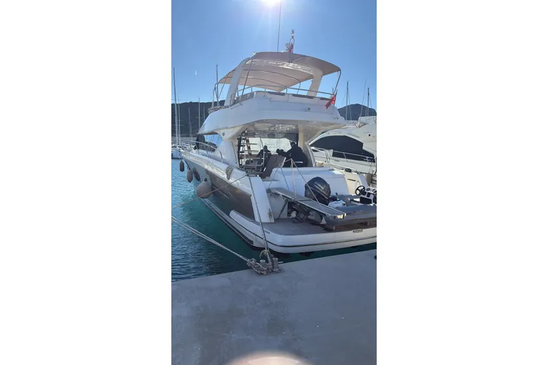  Yacht Photos Pics Luxury 2011 Prestige 60 yacht docked in sunny marina.