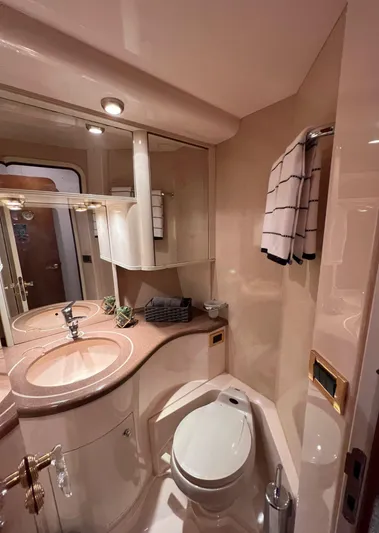 Yacht Photos Pics Luxurious bathroom in a 2001 Azimut 58 yacht with modern fixtures.
