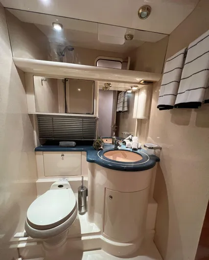  Yacht Photos Pics Luxurious bathroom in a 2001 Azimut 58 yacht with modern fixtures and elegant design.