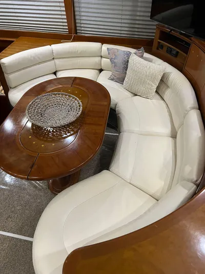  Yacht Photos Pics Luxurious interior of a 2001 Azimut 58 yacht with curved white leather seating.