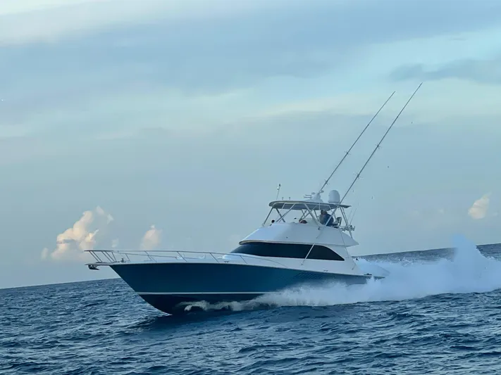 Yacht Photos Pics 2007 Viking 52 Convertibles yacht cruising on open sea under clear sky.