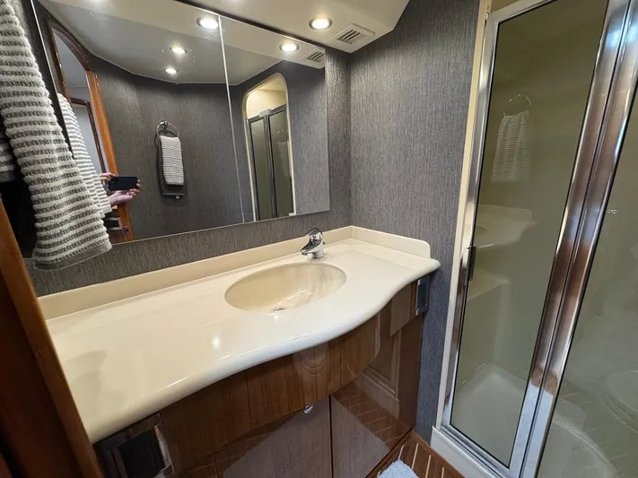  Yacht Photos Pics Bathroom interior of 2007 Viking 52 Convertibles yacht with sink and shower.