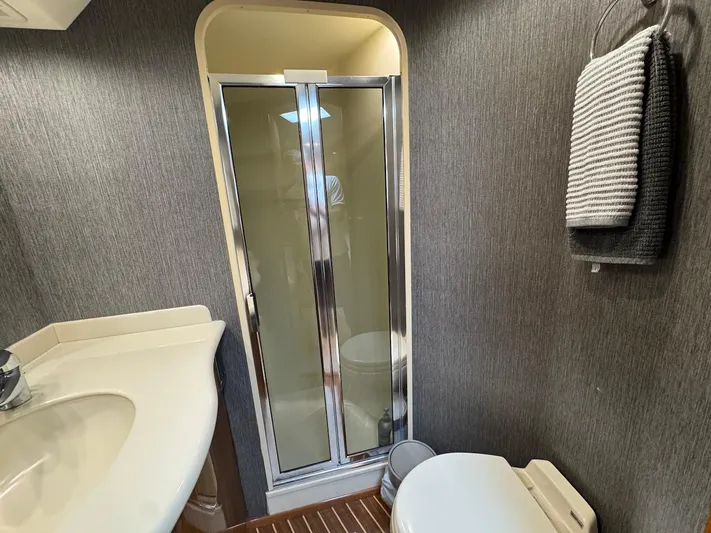  Yacht Photos Pics Bathroom interior of 2007 Viking 52 Convertibles yacht with shower and sink.