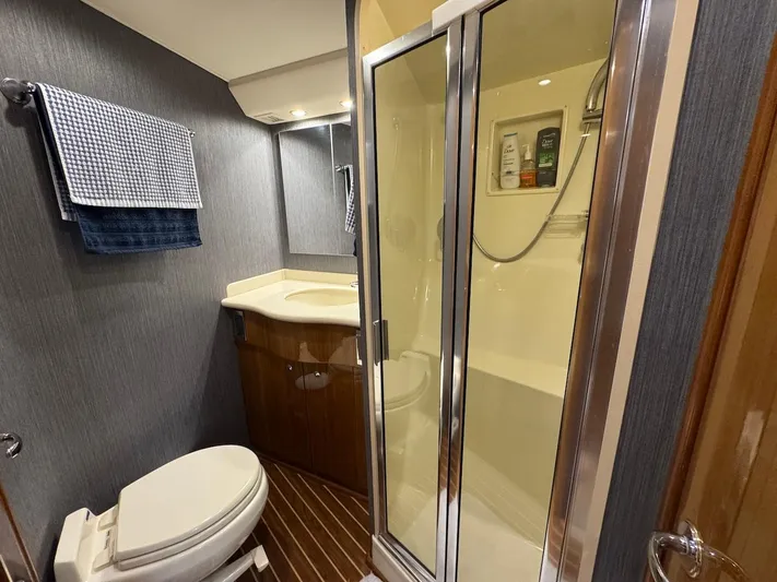  Yacht Photos Pics Bathroom interior of 2007 Viking 52 Convertibles yacht with shower and toilet.