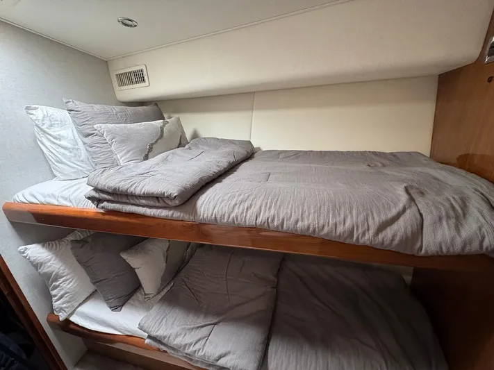  Yacht Photos Pics Bunk beds with gray bedding in a 2007 Viking 52 Convertibles yacht cabin.