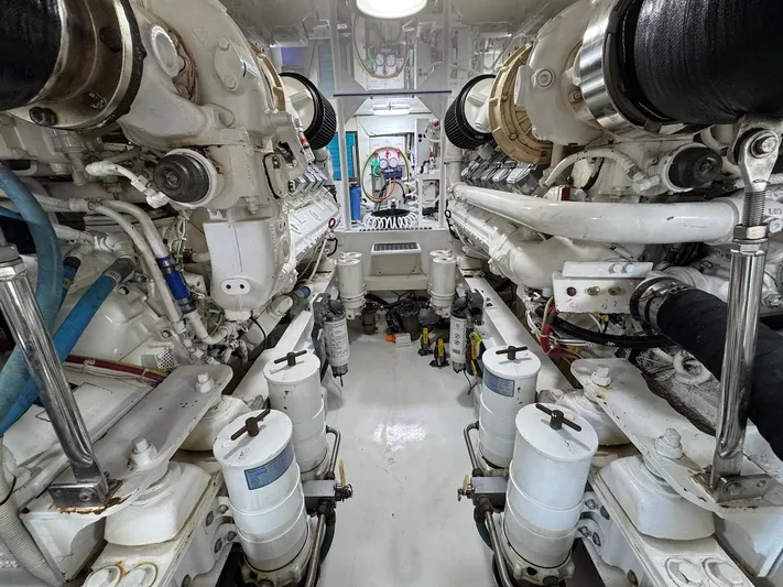  Yacht Photos Pics Engine room of a 2007 Viking 52 Convertibles yacht, showcasing dual engines and mechanical components.