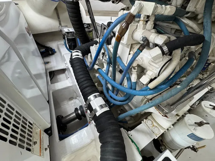  Yacht Photos Pics Engine room of a 2007 Viking 52 Convertibles with hoses and mechanical components.