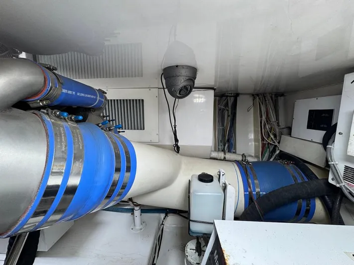  Yacht Photos Pics Engine room of 2007 Viking 52 Convertibles with blue hoses and wiring.