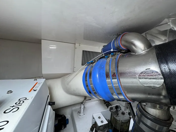  Yacht Photos Pics Engine room of 2007 Viking 52 Convertibles with visible exhaust system components.