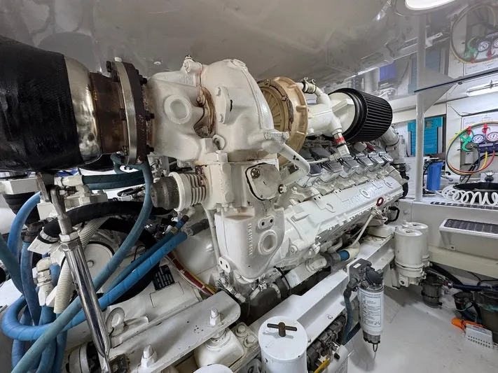  Yacht Photos Pics Engine room of a 2007 Viking 52 Convertibles yacht, showcasing detailed machinery and components.