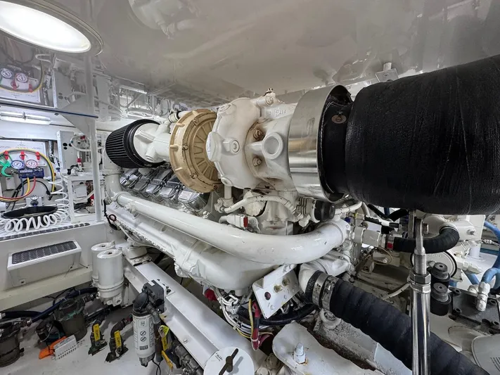  Yacht Photos Pics Engine room of a 2007 Viking 52 Convertibles yacht, showcasing detailed machinery and components.