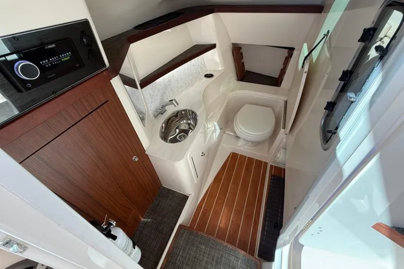  Yacht Photos Pics 2023 Grady-White Freedom 325 boat interior with modern bathroom amenities.