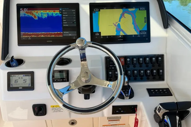  Yacht Photos Pics 2023 Grady-White Freedom 325 helm with dual Garmin displays and control panel.