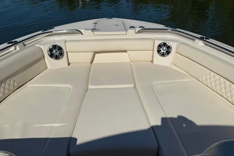  Yacht Photos Pics 2023 Grady-White Freedom 325 boat interior with cushioned seating and speakers.