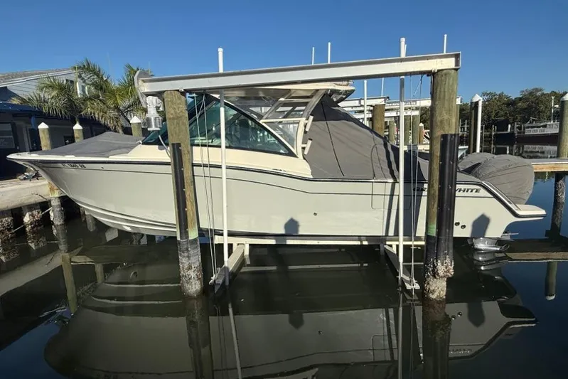 Yacht Photos Pics 2023 Grady-White Freedom 325 boat on lift, docked in marina.