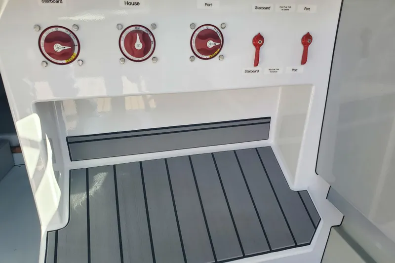  Yacht Photos Pics Control panel of a 1989 Boston Whaler Challenger boat with switches and dials.