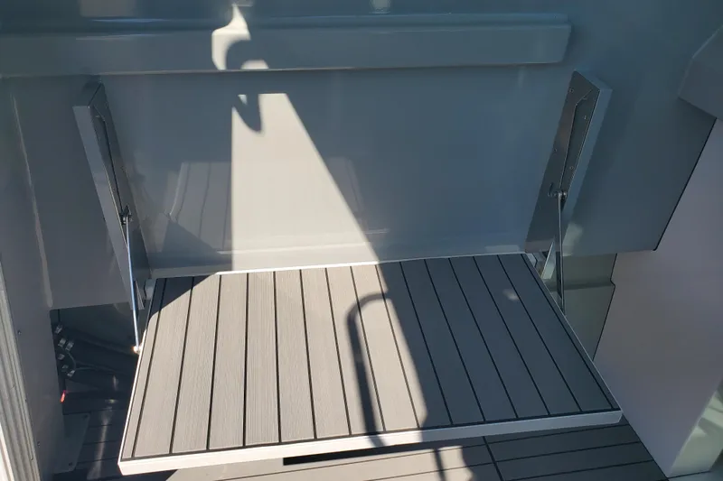  Yacht Photos Pics 1989 Boston Whaler Challenger boat deck with sleek, modern design and durable materials.