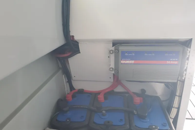  Yacht Photos Pics 1989 Boston Whaler Challenger battery compartment with Guest 30 Amp charger.