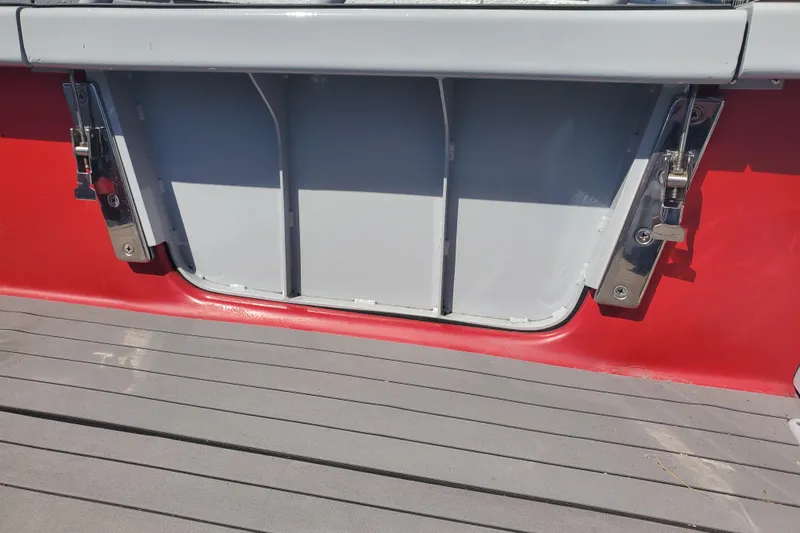  Yacht Photos Pics 1989 Boston Whaler Challenger boat deck with red and gray detailing.
