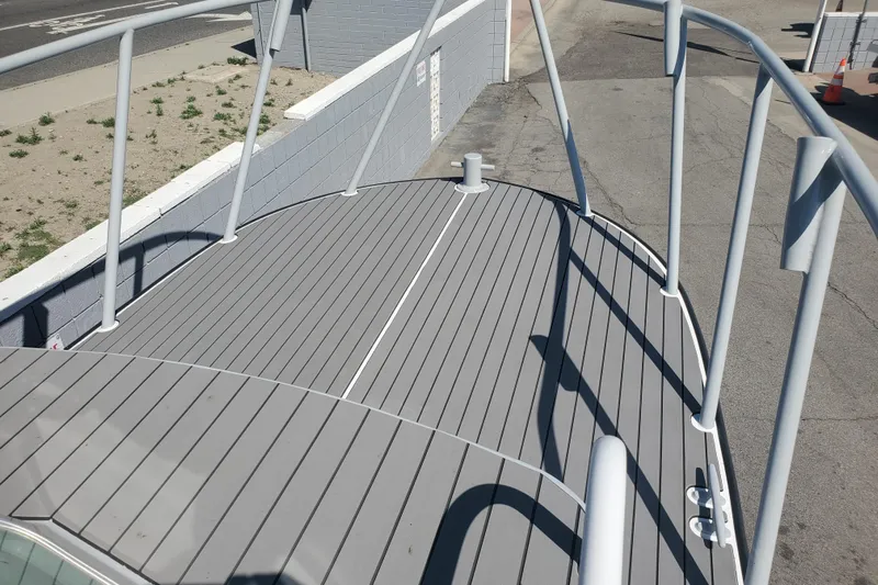  Yacht Photos Pics 1989 Boston Whaler Challenger boat deck with gray flooring and railings.