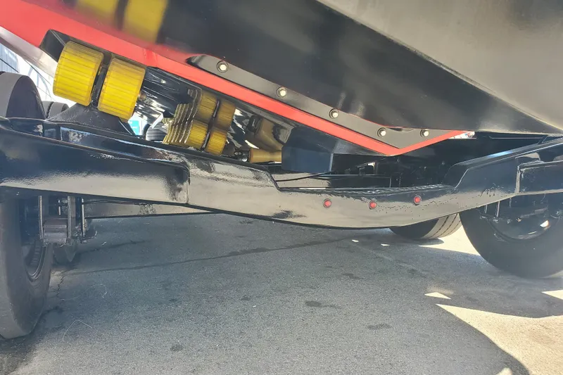  Yacht Photos Pics 1989 Boston Whaler Challenger boat trailer with yellow rollers and black frame.