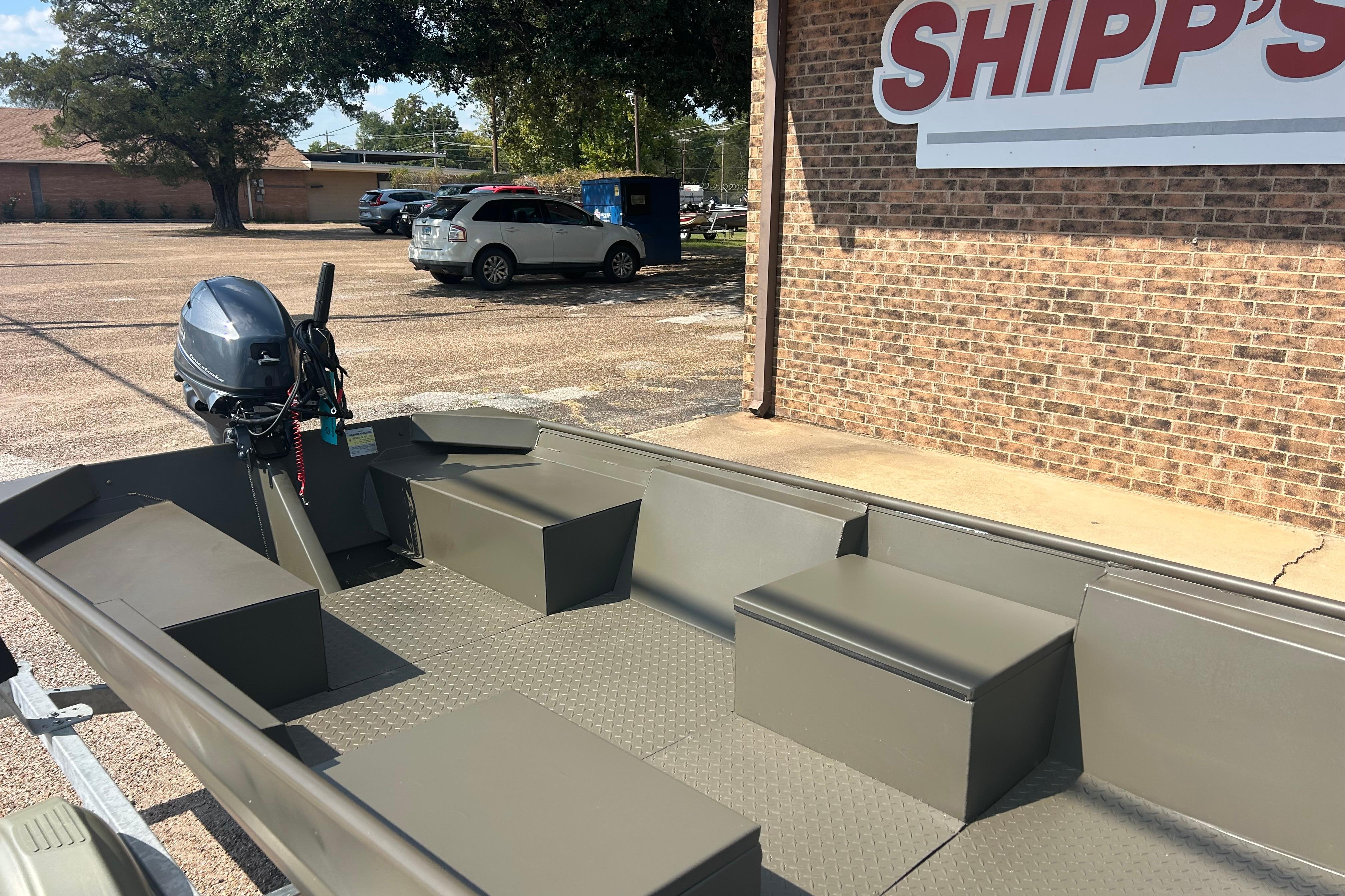 2025 WeldBilt 1652 boat with motor, parked outside Shipp's store.