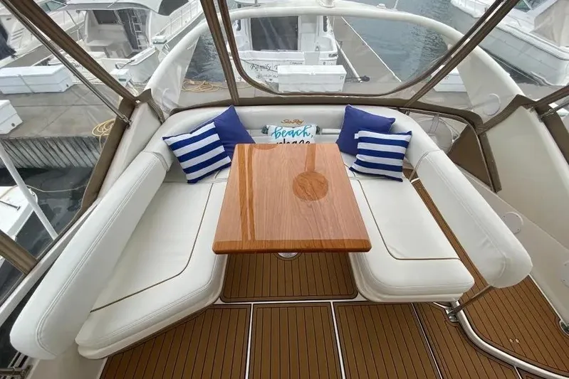  Yacht Photos Pics Luxurious seating area on 2000 Sea Ray 400 Sedan Bridge yacht with striped cushions.