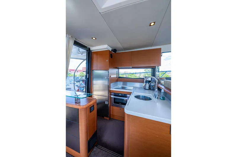  Yacht Photos Pics Luxurious kitchen interior of 2012 Prestige Flybridge yacht with modern appliances and sleek design.