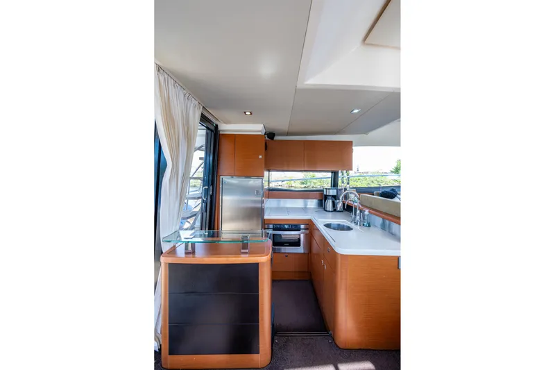  Yacht Photos Pics Luxurious kitchen interior of 2012 Prestige Flybridge yacht with modern appliances and sleek design.