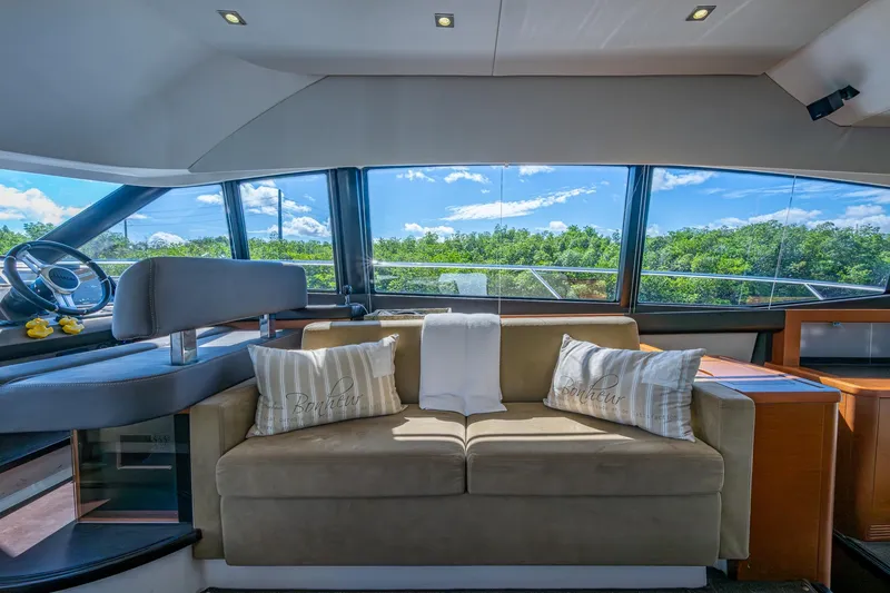  Yacht Photos Pics Luxurious interior of 2012 Prestige Flybridge yacht with scenic window views.
