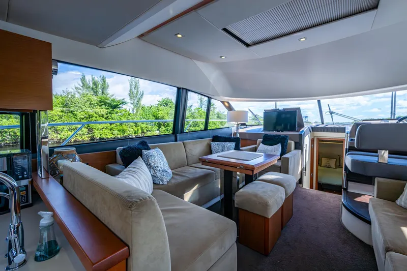 Yacht Photos Pics Luxurious interior of 2012 Prestige Flybridge yacht with plush seating and modern amenities.