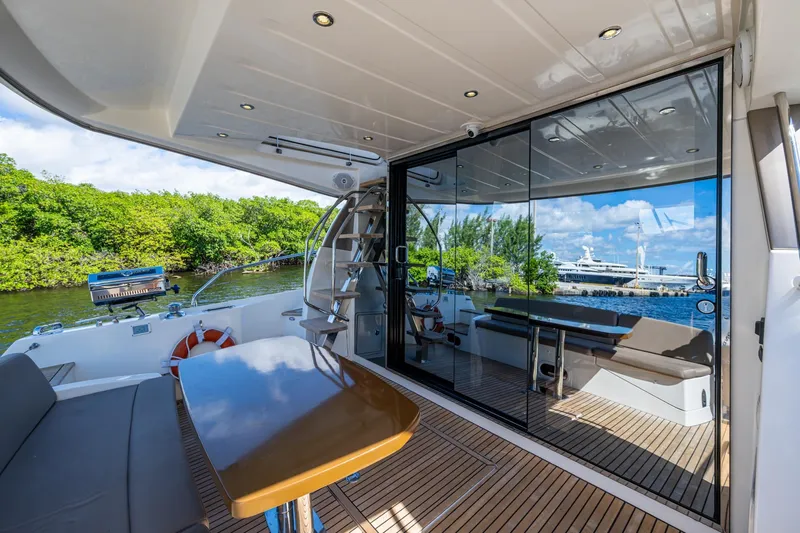  Yacht Photos Pics Luxurious 2012 Prestige Flybridge yacht interior with sleek design and scenic waterfront view.