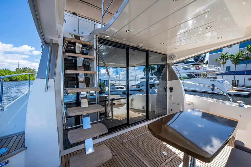  Yacht Photos Pics Luxurious 2012 Prestige Flybridge yacht interior with modern staircase and sleek design.