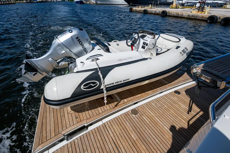  Yacht Photos Pics Inflatable boat with Honda motor on Prestige Flybridge 2012 yacht deck.
