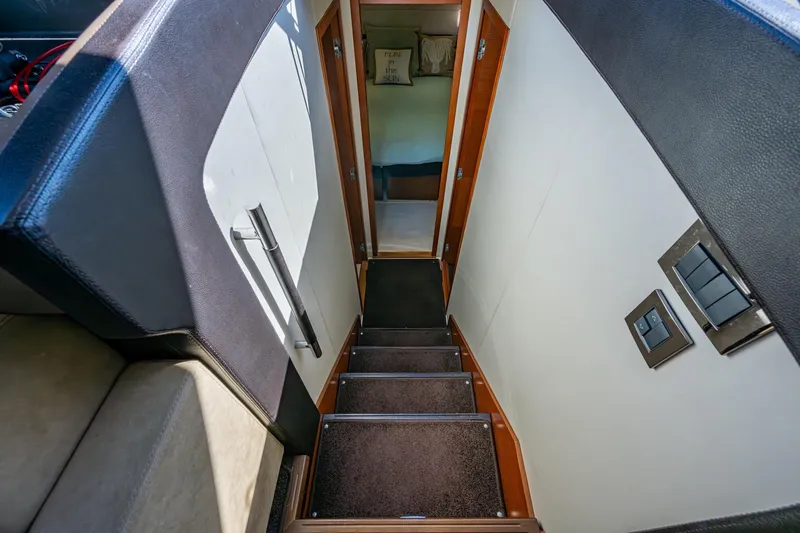  Yacht Photos Pics Staircase leading to cabin interior of 2012 Prestige Flybridge yacht.