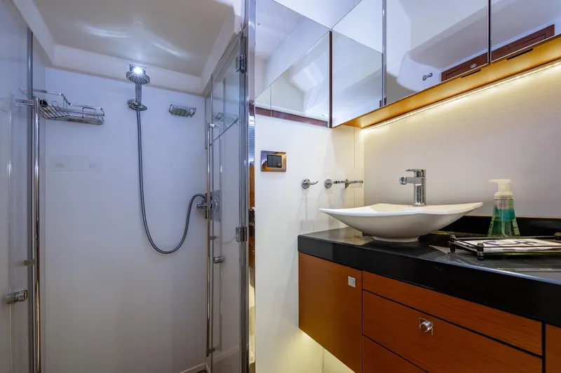  Yacht Photos Pics Luxurious 2012 Prestige Flybridge yacht bathroom with modern shower and sleek vanity.