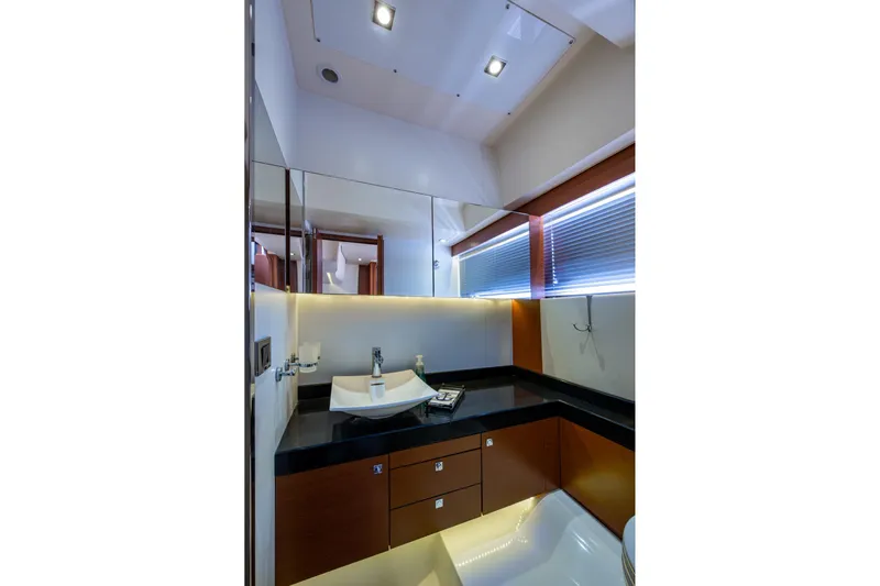  Yacht Photos Pics Luxurious bathroom in 2012 Prestige Flybridge yacht with modern fixtures and sleek design.