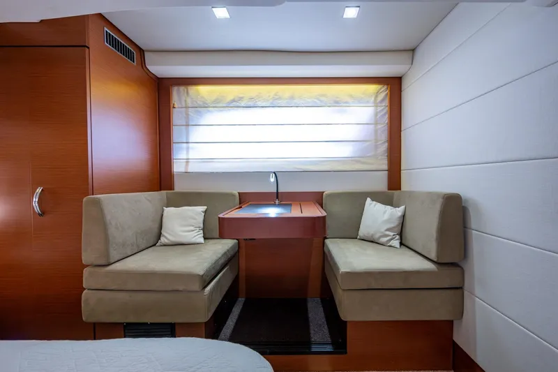  Yacht Photos Pics Luxurious 2012 Prestige Flybridge yacht interior with cozy seating and elegant wood finishes.