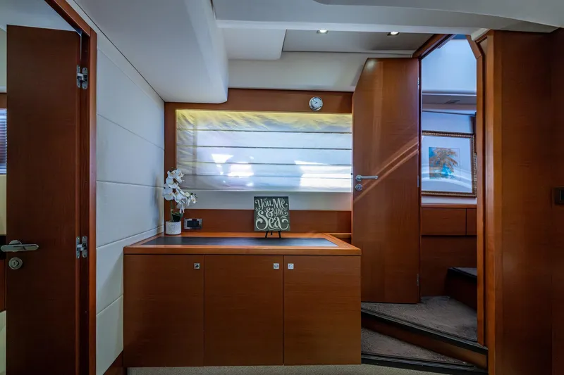  Yacht Photos Pics Interior of 2012 Prestige Flybridge yacht with elegant wood finish and decorative accents.