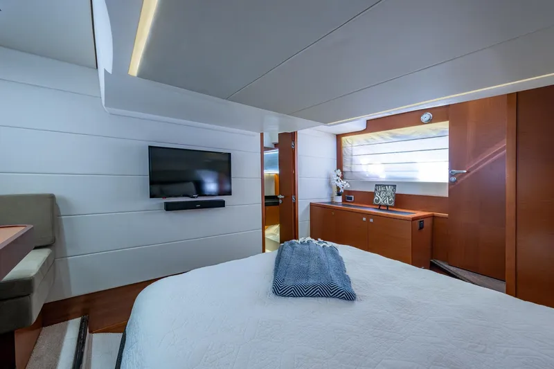  Yacht Photos Pics Luxurious 2012 Prestige Flybridge yacht bedroom with modern decor and flat-screen TV.