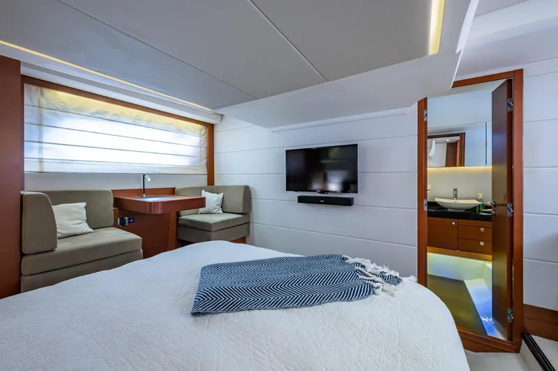  Yacht Photos Pics Luxurious 2012 Prestige Flybridge yacht bedroom with modern decor and ensuite bathroom.