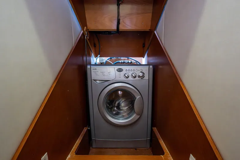  Yacht Photos Pics Washing machine in 2012 Prestige Flybridge yacht's wooden compartment.