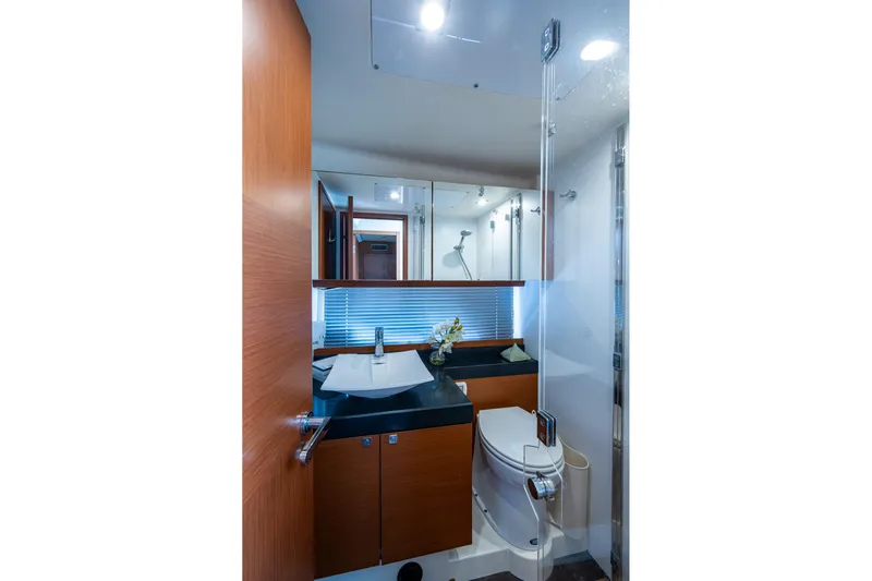  Yacht Photos Pics Luxurious bathroom in 2012 Prestige Flybridge yacht with modern fixtures and elegant design.