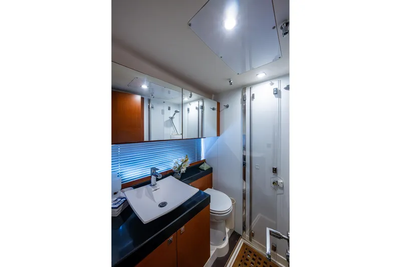  Yacht Photos Pics Luxurious bathroom in 2012 Prestige Flybridge yacht with modern fixtures and elegant design.