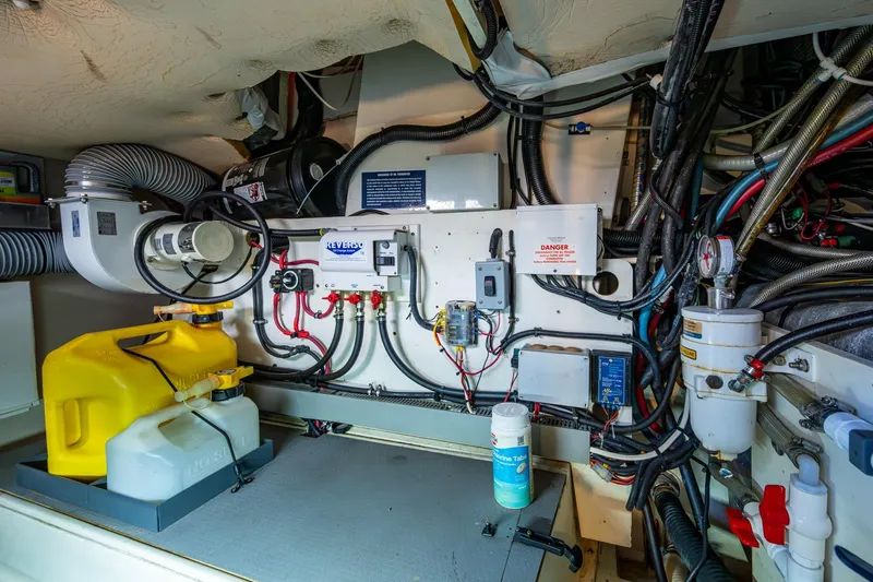  Yacht Photos Pics Engine room of a 2012 Prestige Flybridge yacht with various mechanical components.