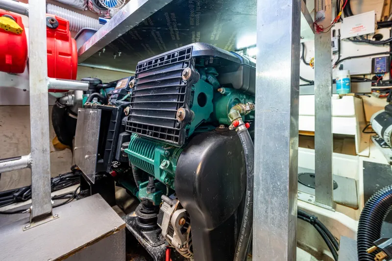  Yacht Photos Pics Engine room of 2012 Prestige Flybridge yacht, showcasing mechanical components and wiring.