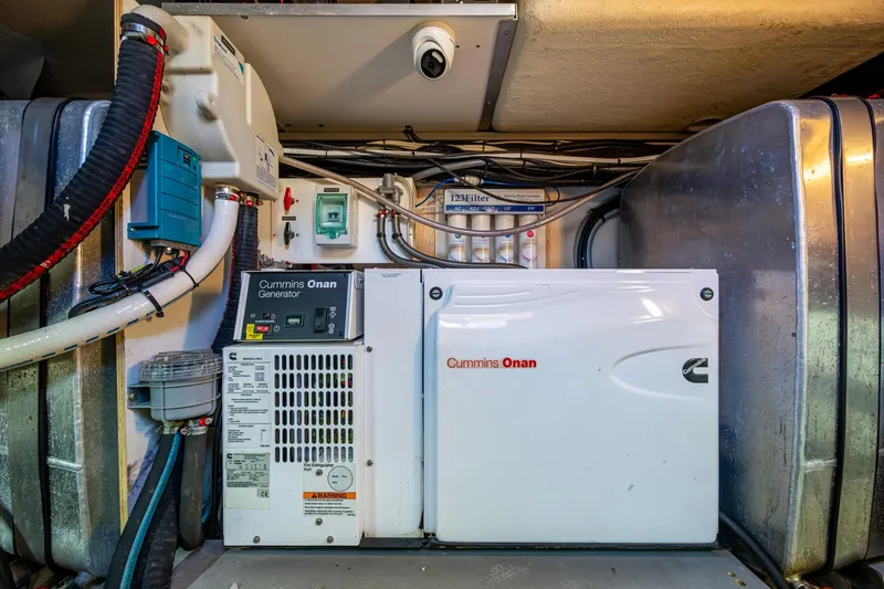  Yacht Photos Pics Engine room of 2012 Prestige Flybridge with Cummins Onan generator and filtration system.