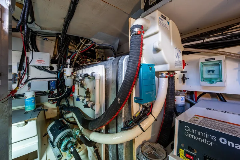  Yacht Photos Pics Engine room of 2012 Prestige Flybridge yacht with Cummins generator and complex wiring.