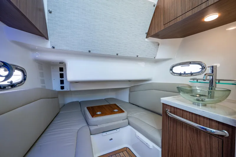  Yacht Photos Pics Luxurious interior of 2024 Boston Whaler 380 Outrage with modern seating and glass sink.