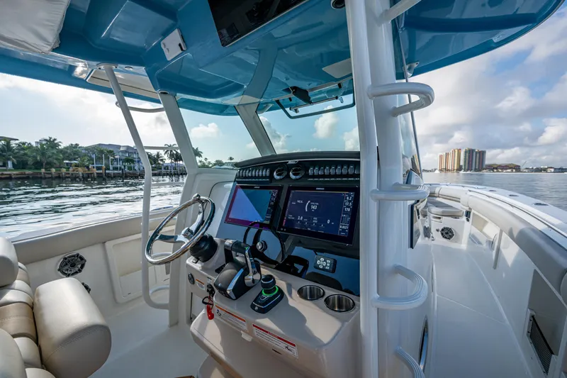  Yacht Photos Pics 2024 Boston Whaler 380 Outrage boat cockpit with advanced navigation system.